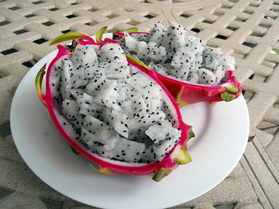 how to eat a Vietnamese white giant pitaya dragon fruit how to cut it and served on a plate