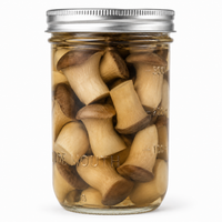 A clear glass mason jar with a silver metal lid, filled with sliced mushrooms submerged in liquid, photographed on a clean white background.