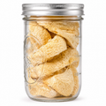 A clear glass jar with a silver metal screw-top lid, filled with dried, lionsmane photographed on a plain white background.