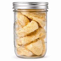 A clear glass jar with a silver metal screw-top lid, filled with dried, lionsmane photographed on a plain white background.