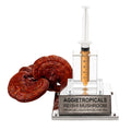 A Reishi mushroom with a glossy reddish-brown lacquered shelf-shaped cap, beside a syringe filled with liquid mycelium culture mounted on a mirrored stand, labeled "AGGIETROPICALS, REISHI, PREMIUM LIQUID MYCELIUM 10cc", on a white background.