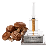 A clear plastic and glass syringe-style container filled with amber liquid, mounted on a silver base labeled AGGietROPICALS SHITAKE, shown beside several brown shiitake mushrooms on a white background.